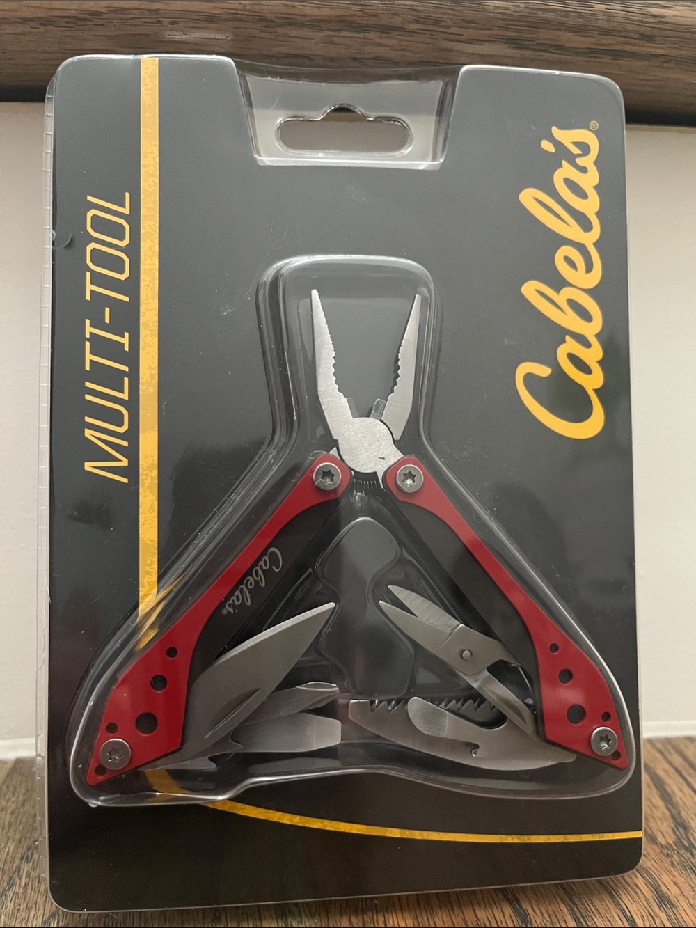Cabela's Red and Silver Multi-Tool Pliers with Folding Blades